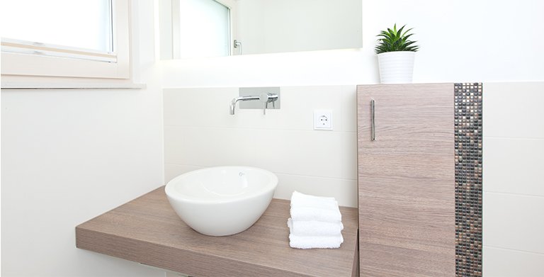 Ein zusätzliches WC für Besucher komplettiert den Grundriss im Erdgeschoss Copyright: TALBAU-Haus GmbH