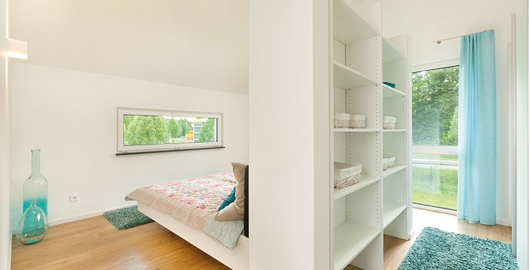 Das Schlafzimmer wurde mit einer integrierten Ankleide realisiert Copyright: TALBAU-Haus GmbH