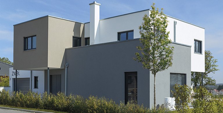 Die Farbgestaltung der Fassade unterstreicht den modernen Charakter des Hauses Copyright: Wolf-Haus